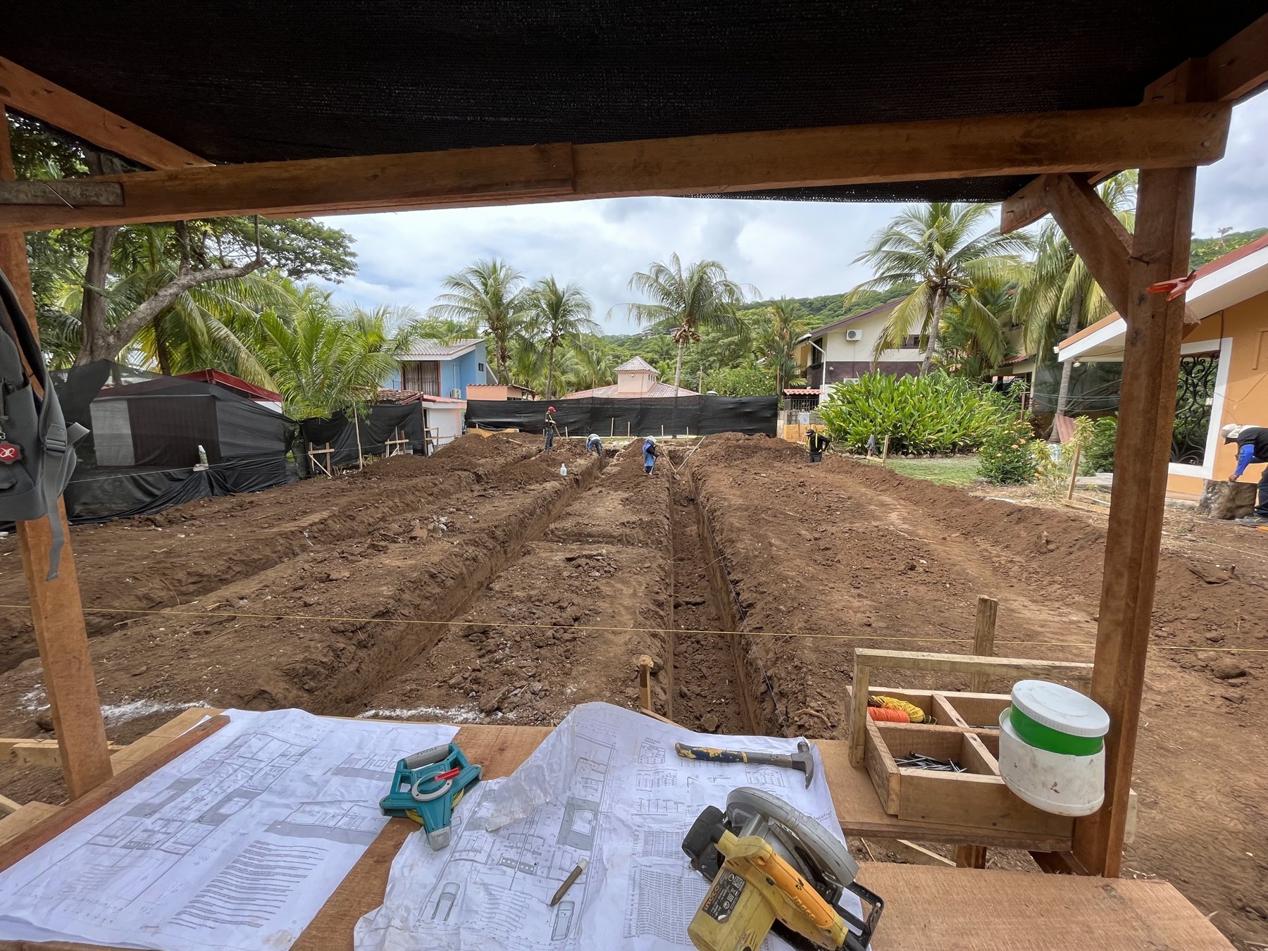 Plans on site during foundation excavation at Casitas Fénix
